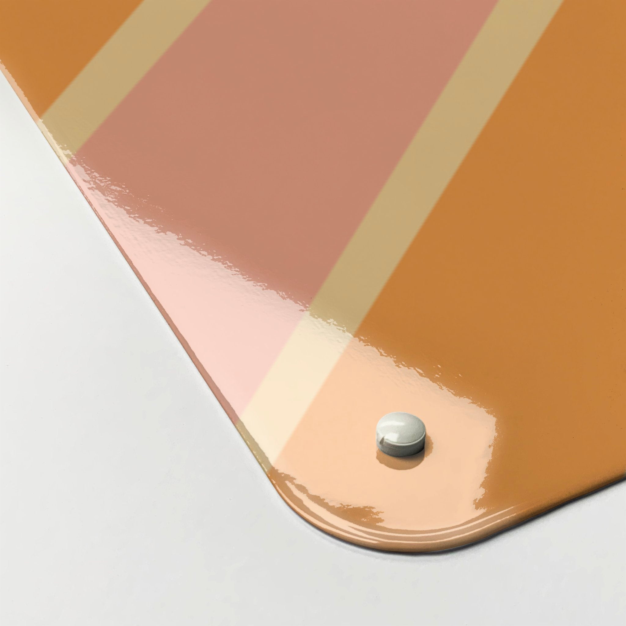 Close up of the corner of large steel magnetic board with a print of a typographic quote design that reads Hello Sunshine with a sunburst in pink and orange colours to show gloss finish