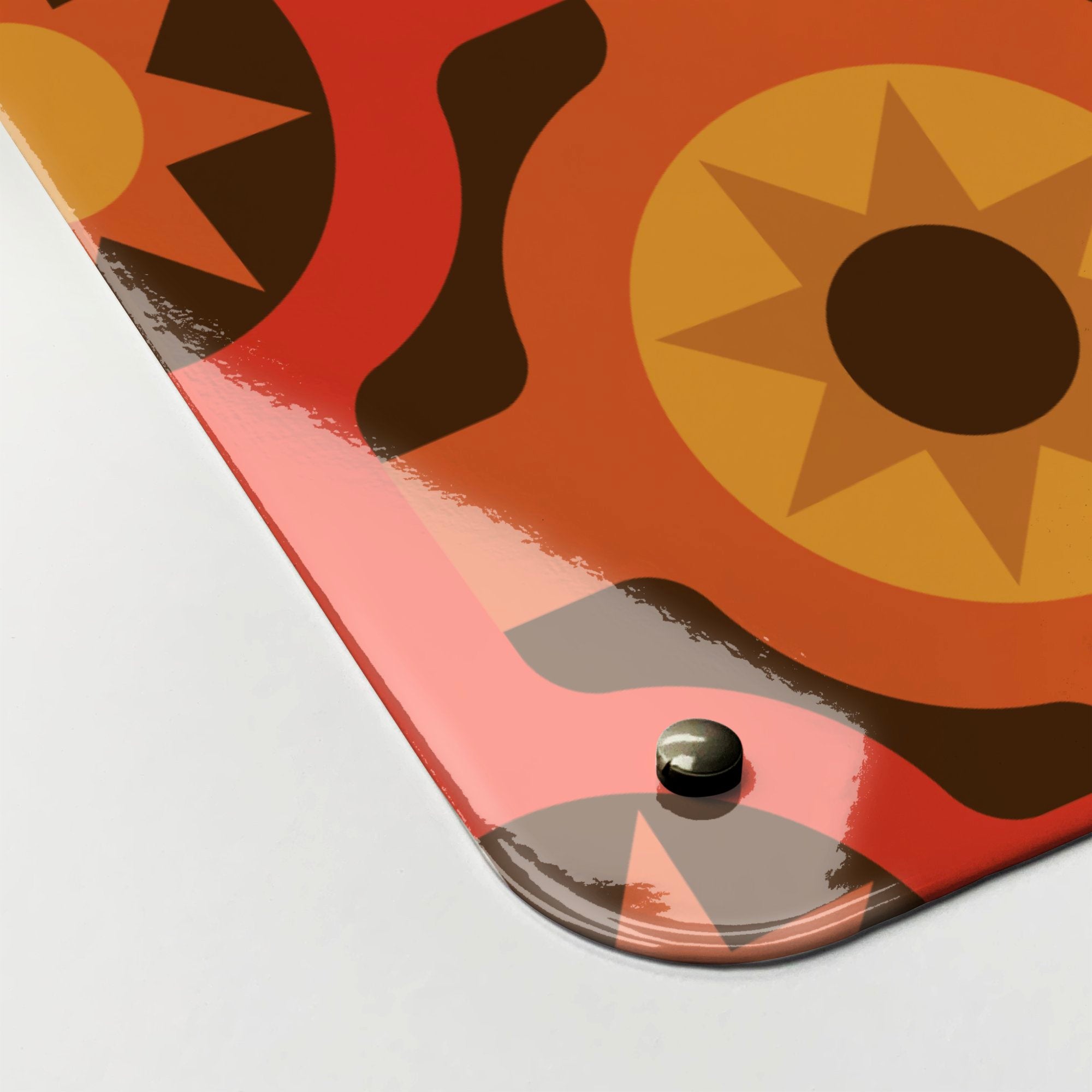 A corner detail to show high gloss surface of a large magnetic notice board with a retro orange and brown pattern