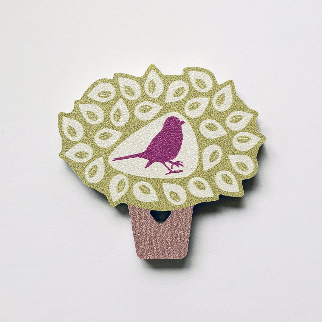 A bird in a tree shaped plywood fridge magnet by Beyond the Fridge