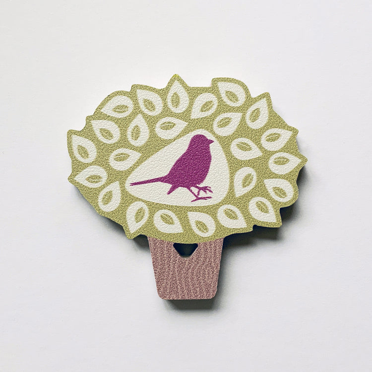 A bird in a tree shaped plywood fridge magnet by Beyond the Fridge