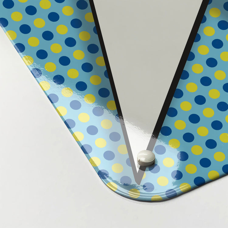 The corner detail of a cartoon idea bubble blue and yellow magnetic board to show it’s high gloss surface