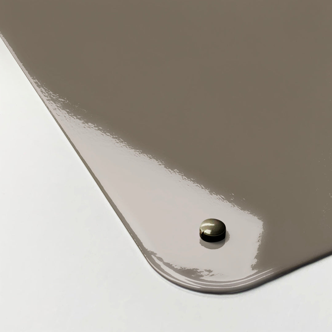 The corner detail of a brown keep calm and carry on magnetic board to show it’s high gloss surface