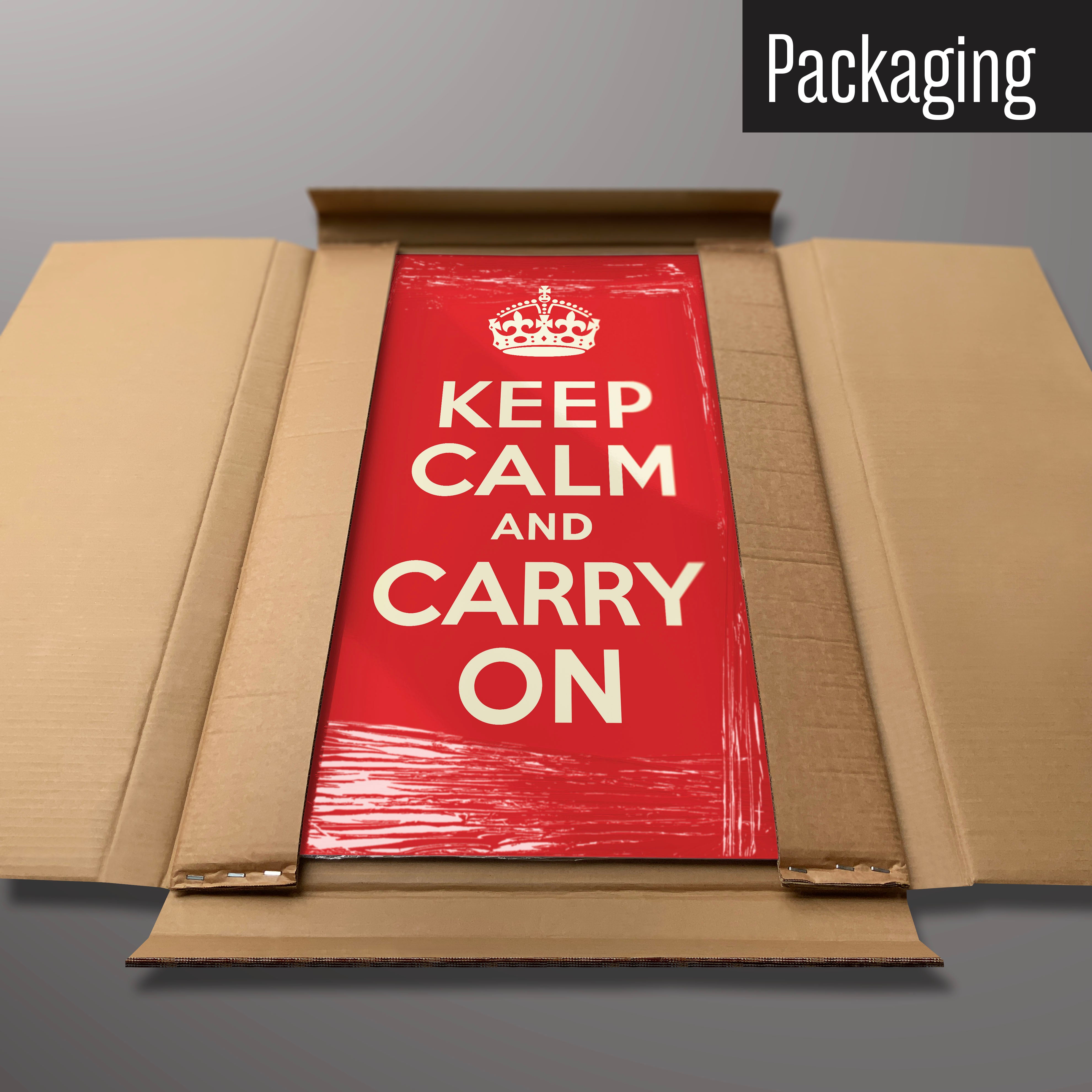 A red keep calm and carry on magnetic board in it’s cardboard packaging