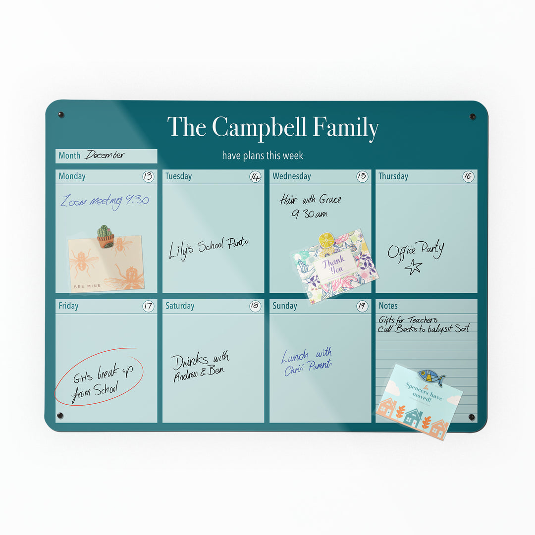 A large magnetic notice board by Beyond the Fridge with a weekly planner design to personalise  in a teal colour and landscape format