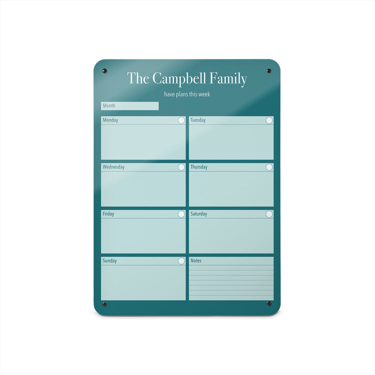 A medium magnetic notice board by Beyond the Fridge with a weekly planner design to personalise  in a teal colour and portrait format 
