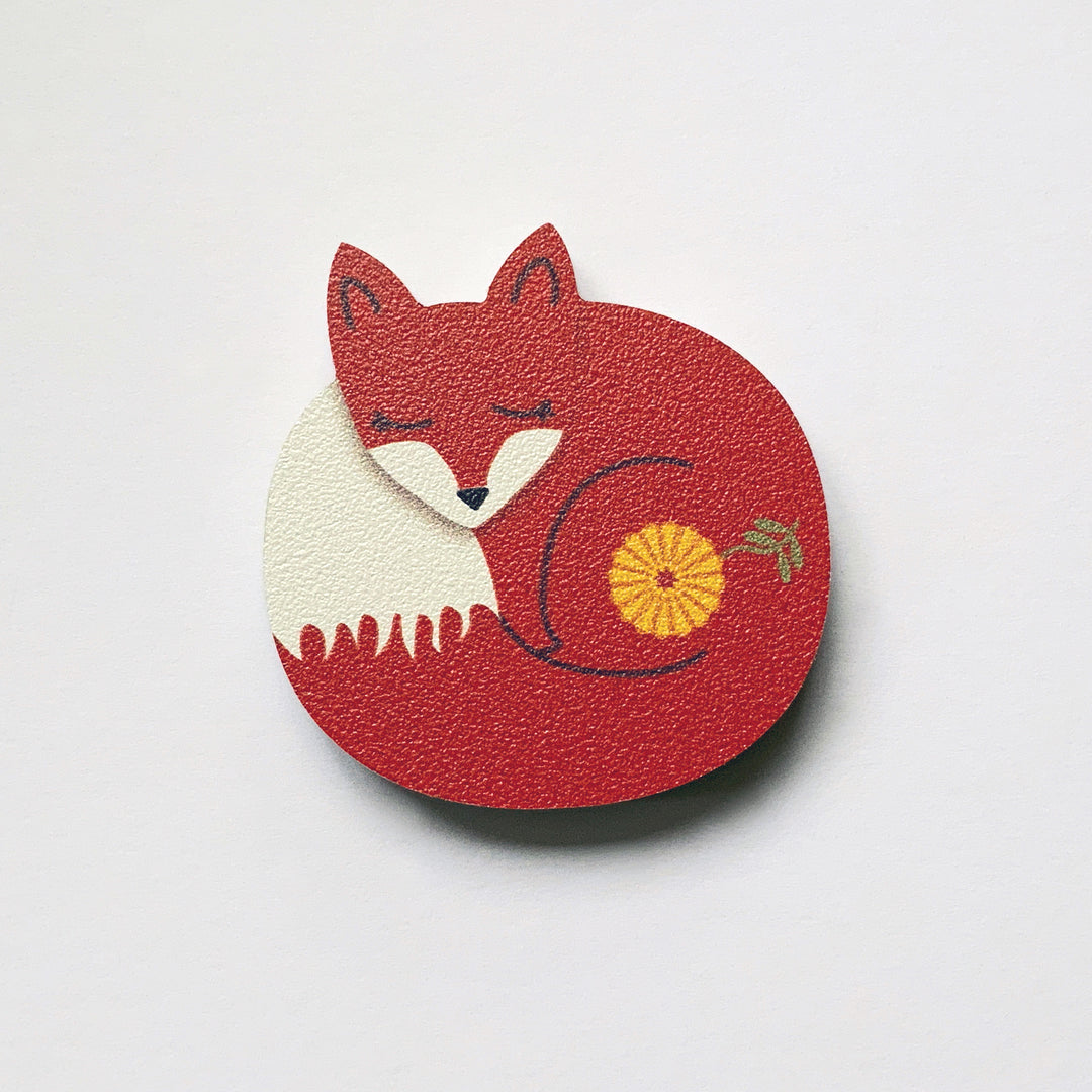 A sleeping fox shaped plywood fridge magnet by Beyond the Fridge