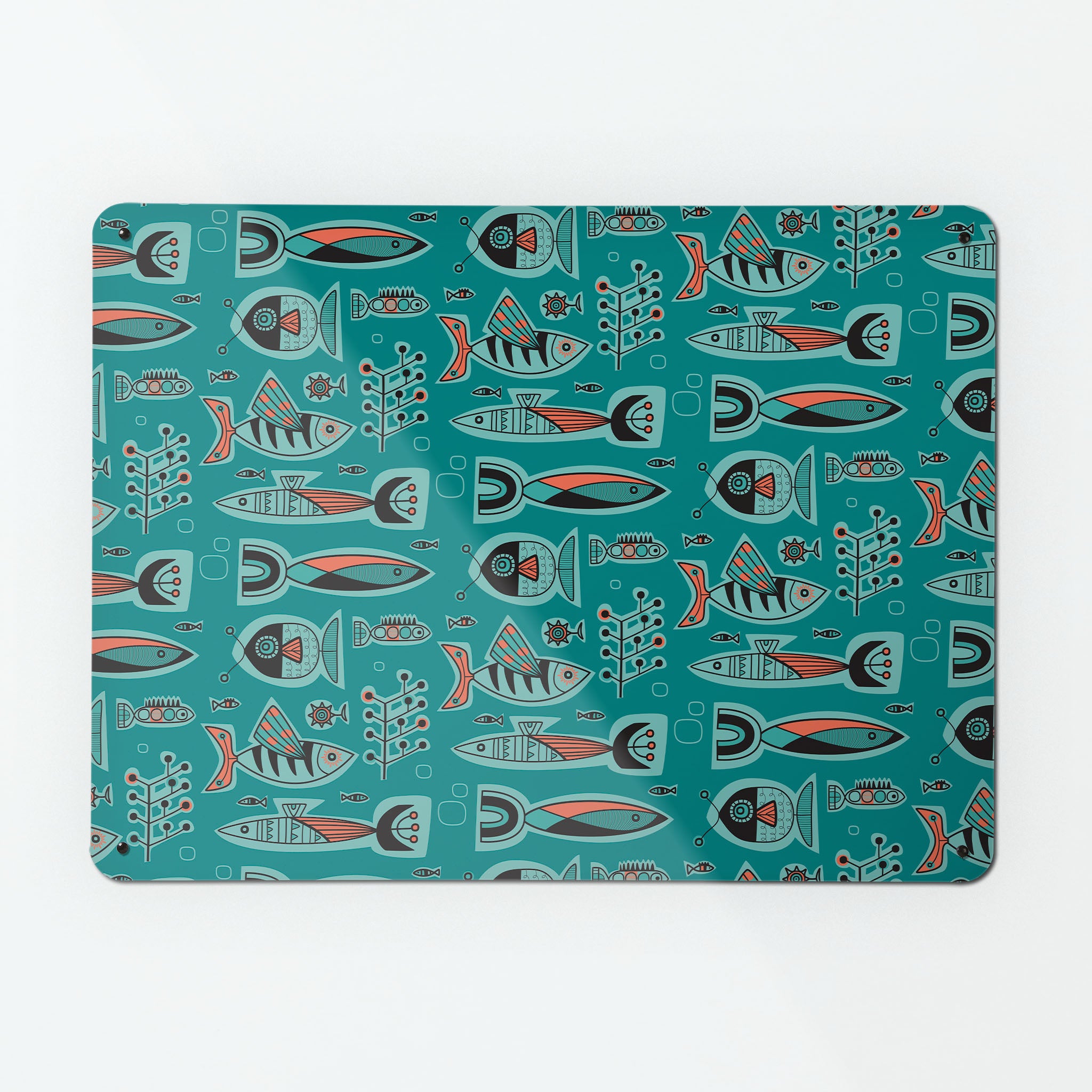 A large magnetic notice board by Beyond the Fridge with a retro style repeat pattern of aquarium fish in aqua colours
