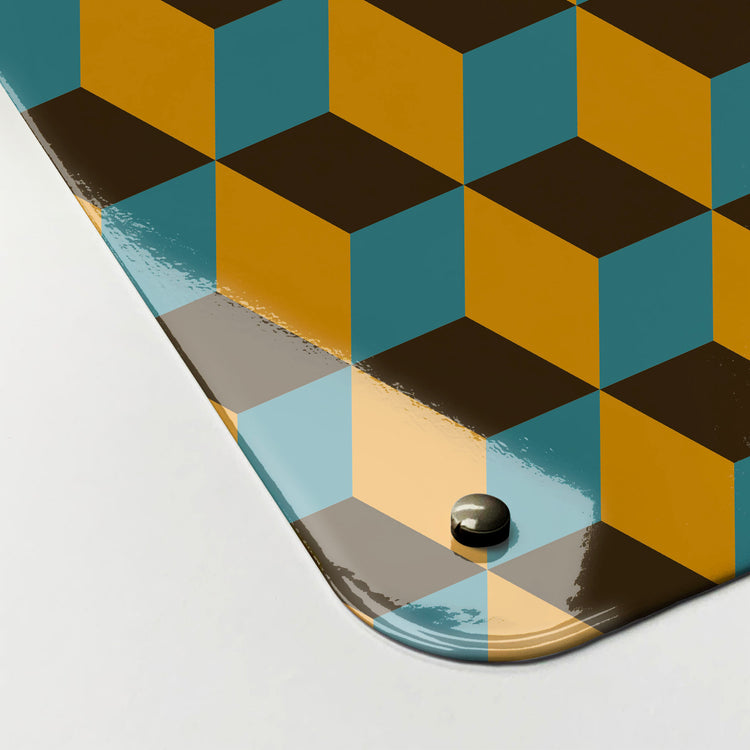 The corner detail of a blocks mustard, blue and brown design magnetic board to show it’s high gloss surface