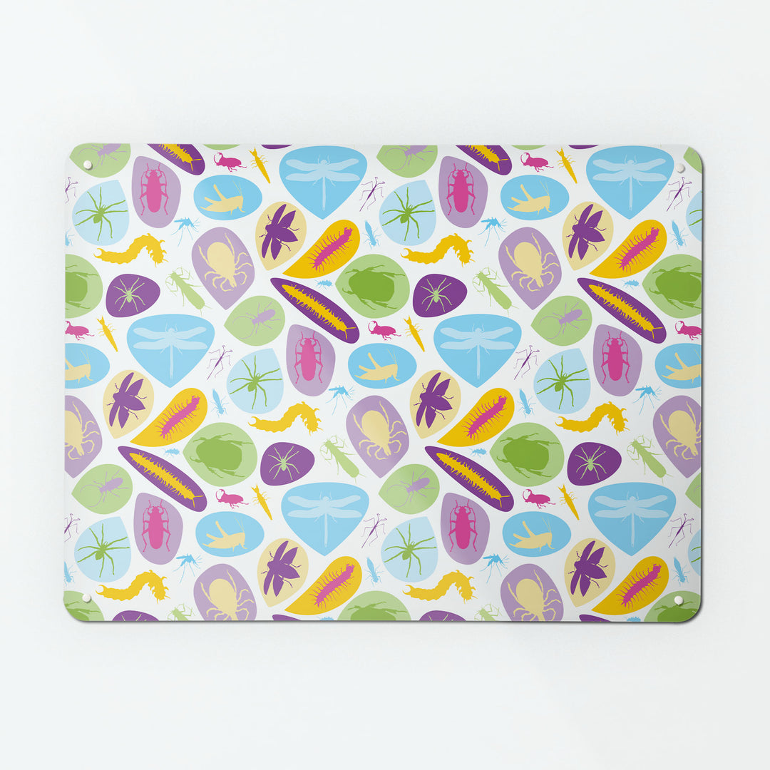 A large magnetic notice board by Beyond the Fridge with a bugs design in bright colours