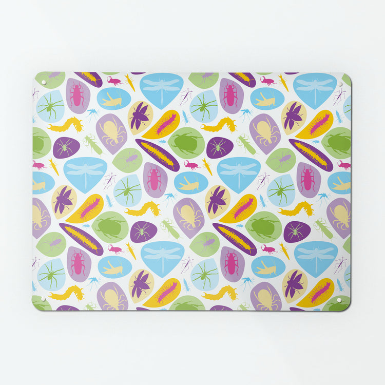 A large magnetic notice board by Beyond the Fridge with a bugs design in bright colours