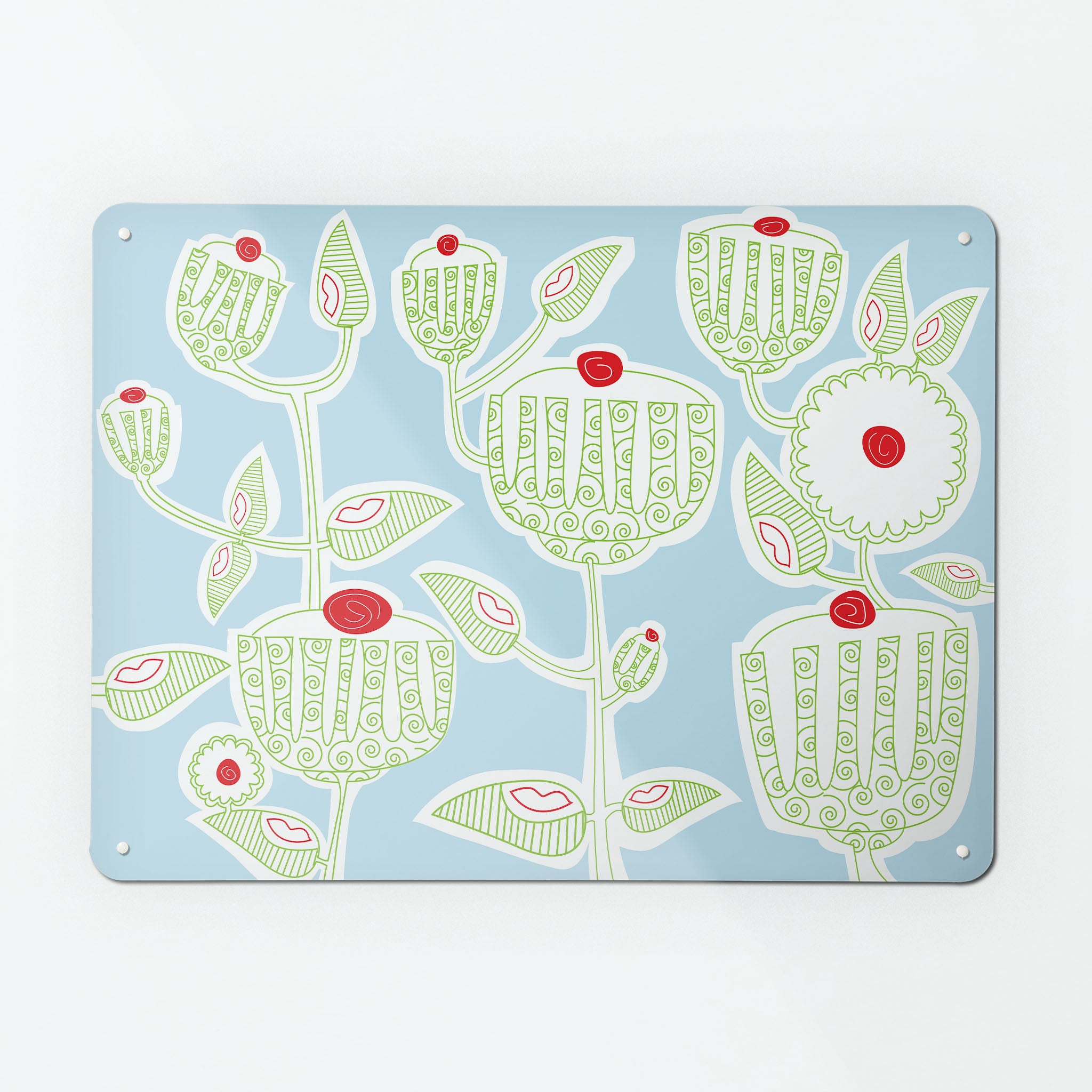 A large magnetic notice board by Beyond the Fridge with a cupcake plant design in green, red, white and blue