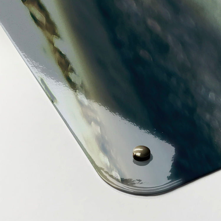 The corner detail of a bicycle and flower basket photographic magnetic board to show it’s high gloss surface