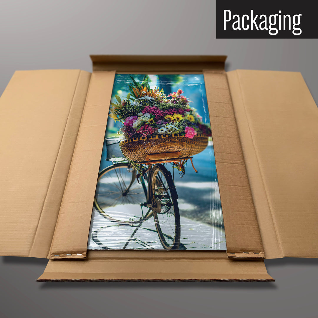 A bicycle and flower basket magnetic board in it’s cardboard packaging
