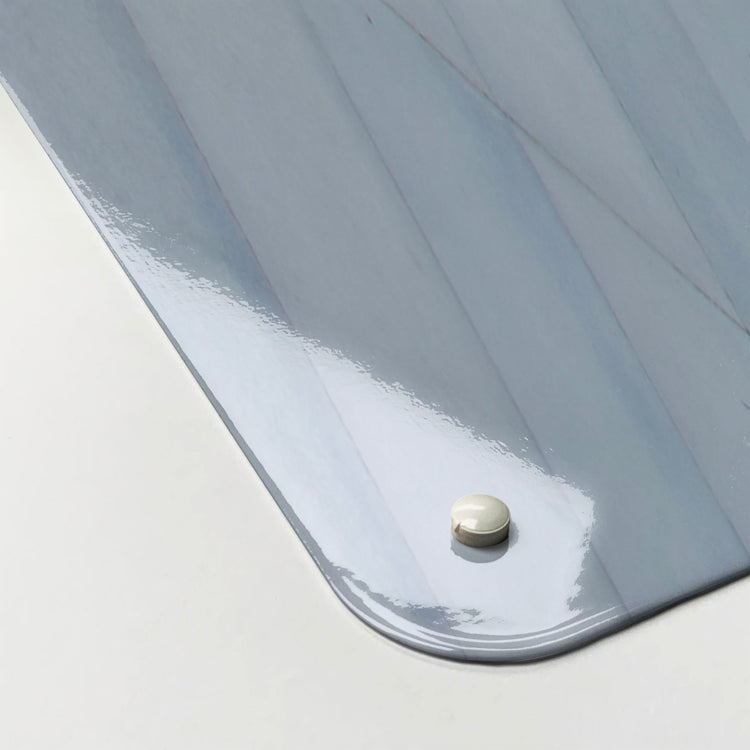 The corner detail of a Heydar Aliyev Centre photographic magnetic board to show it’s high gloss surface