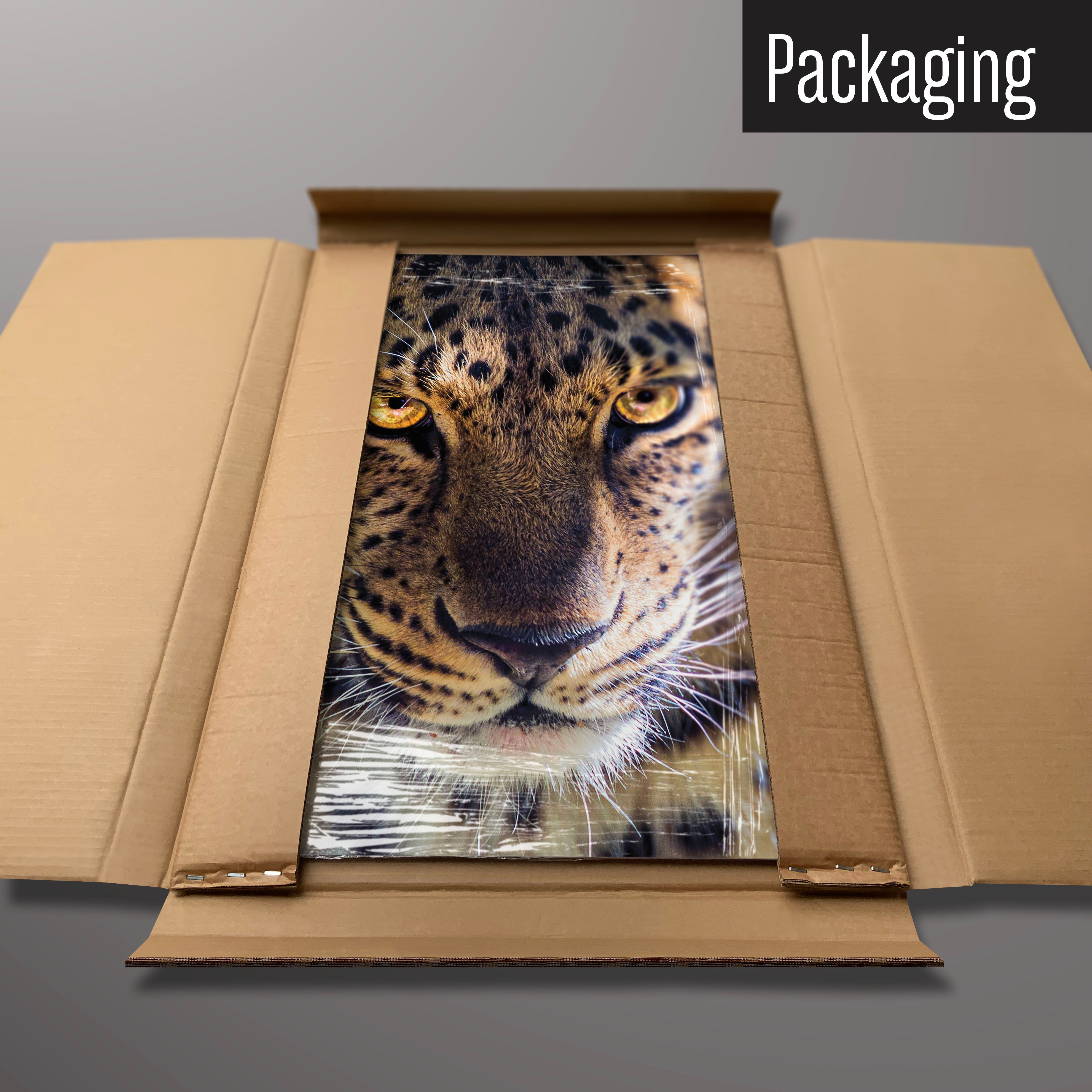 A leopard face magnetic board in it’s cardboard packaging