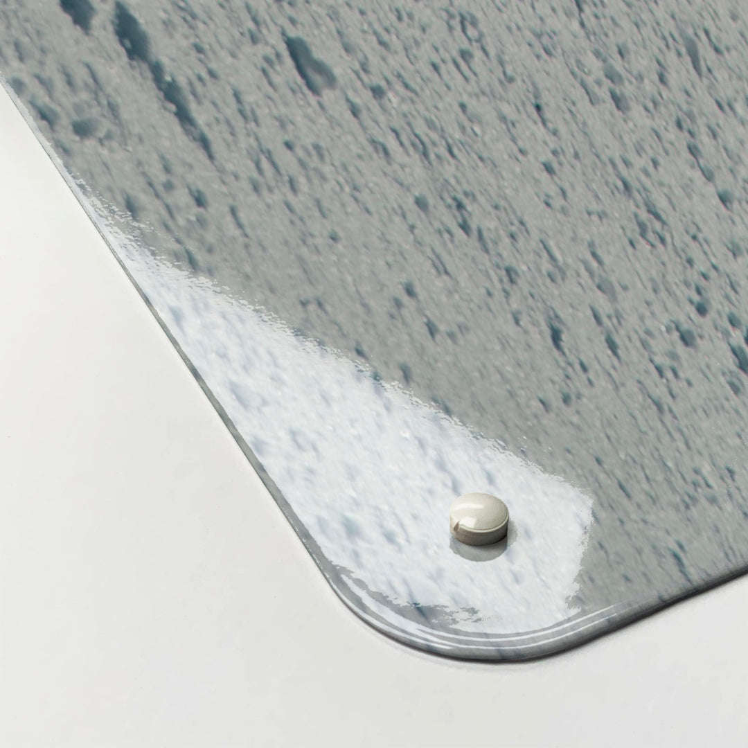 The corner detail of a snowboarding photographic magnetic board to show it’s high gloss surface
