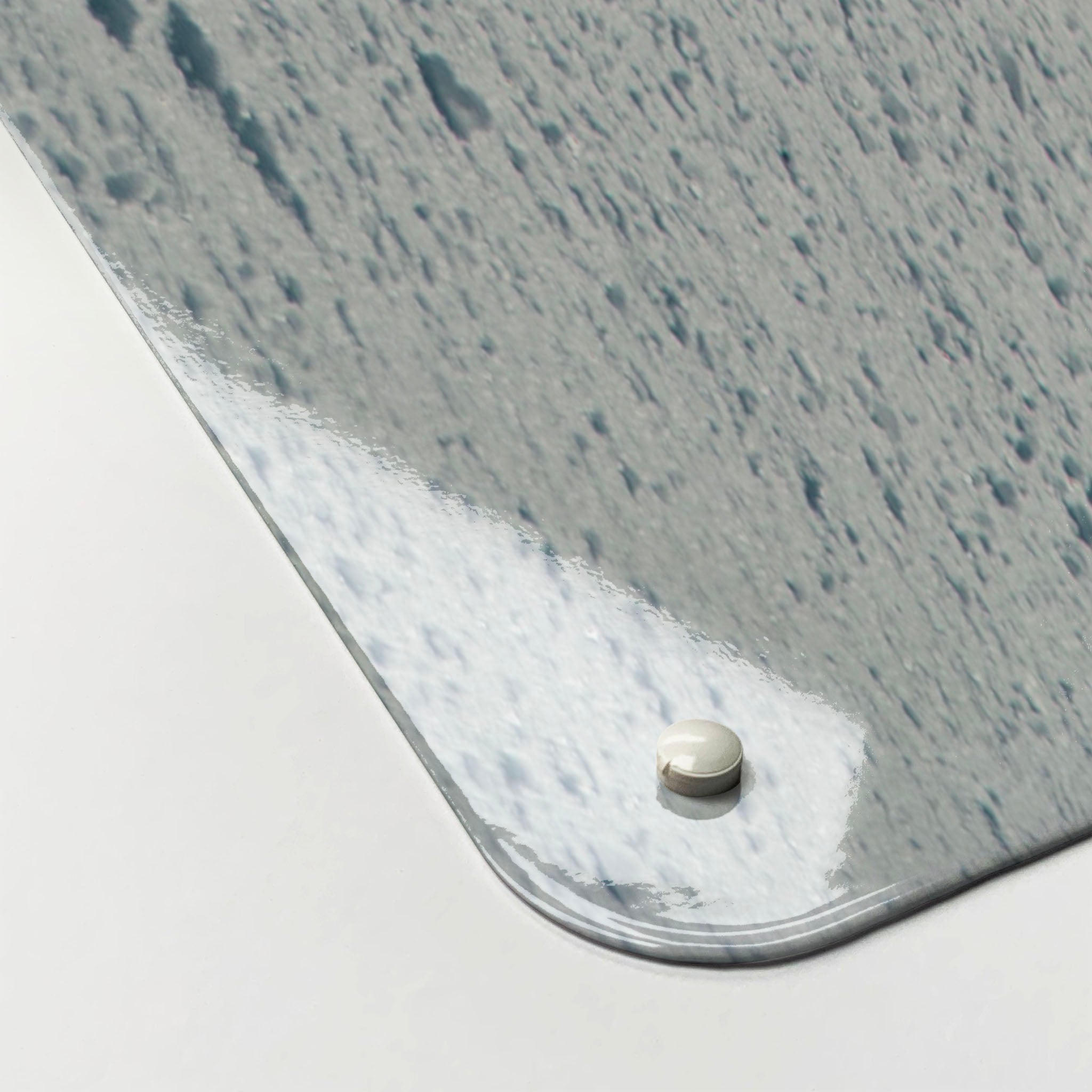 The corner detail of a snowboarding photographic magnetic board to show it’s high gloss surface