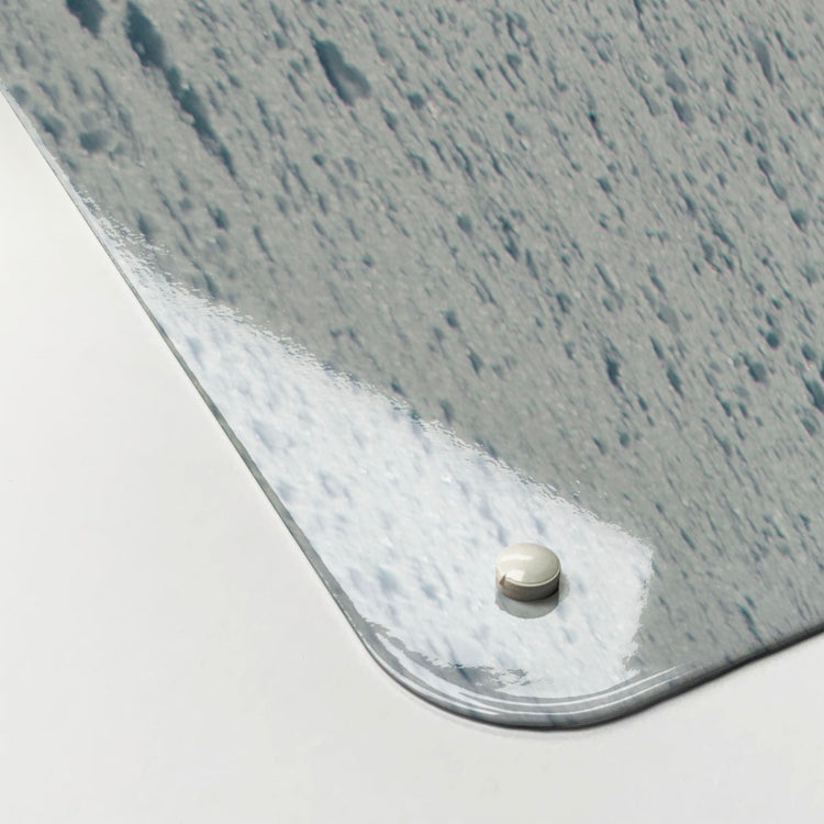 The corner detail of a snowboarding photographic magnetic board to show it’s high gloss surface