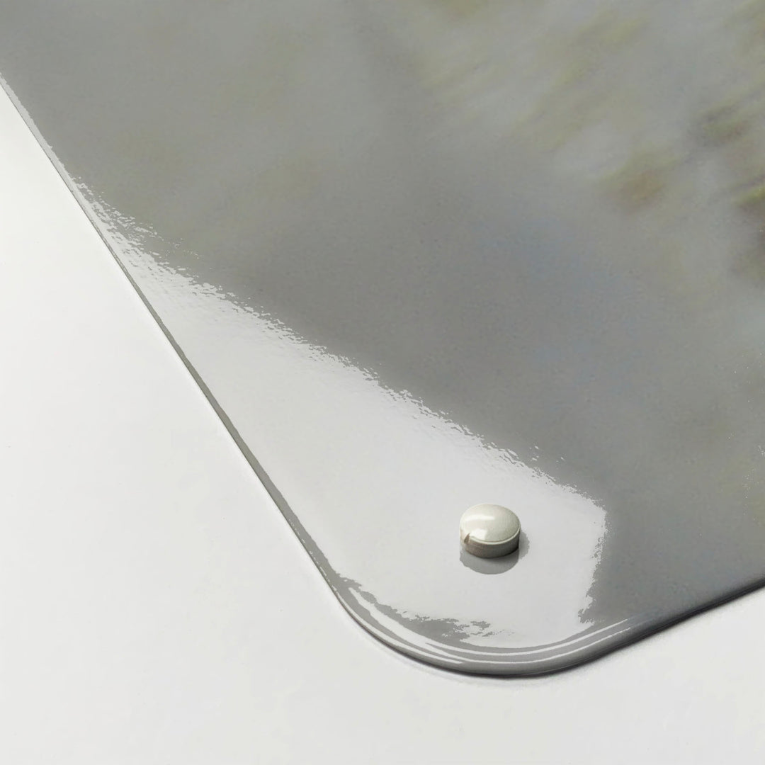 The corner detail of a white peacock photographic magnetic board to show it’s high gloss surface