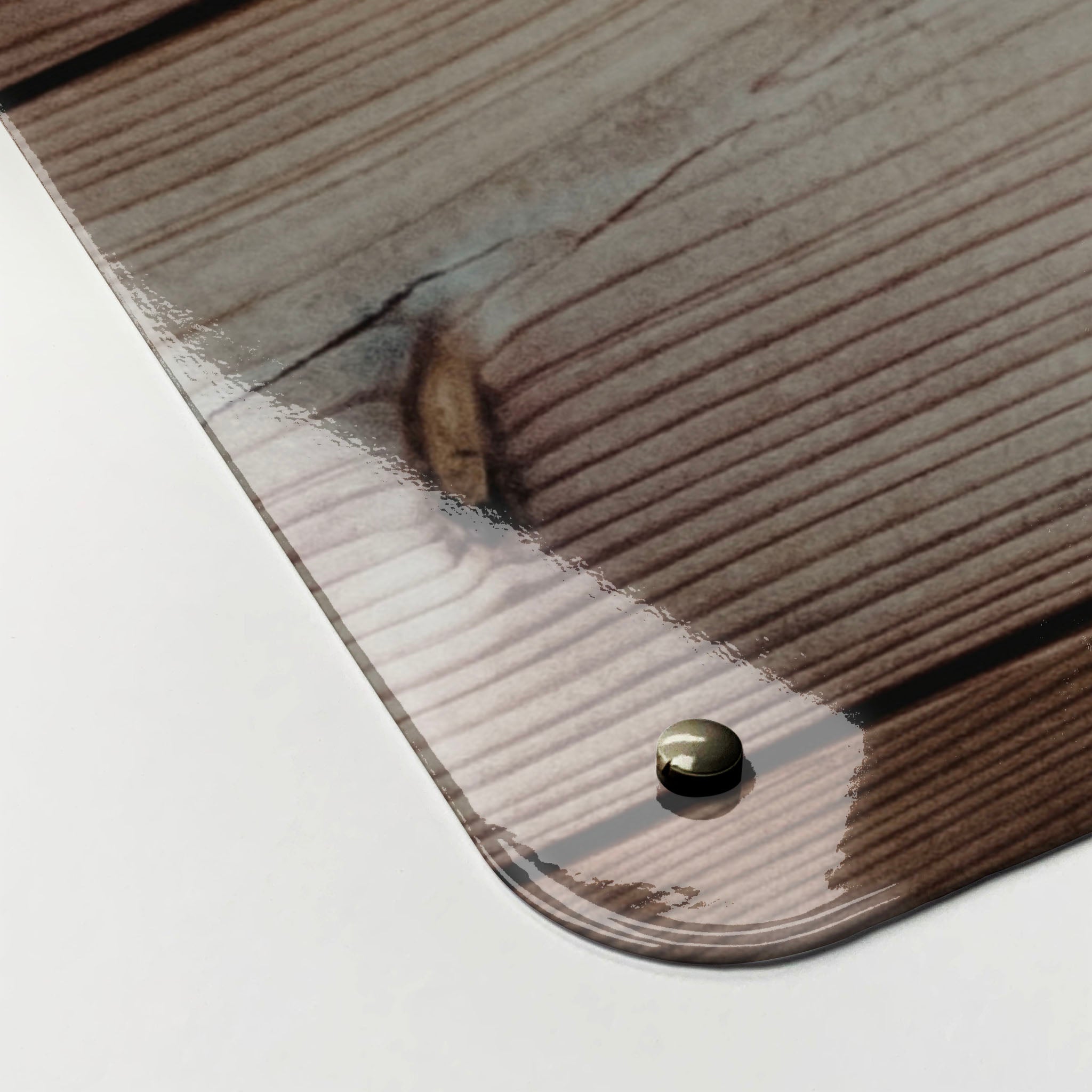 The corner detail of a wood cladding photographic magnetic board to show it’s high gloss surface