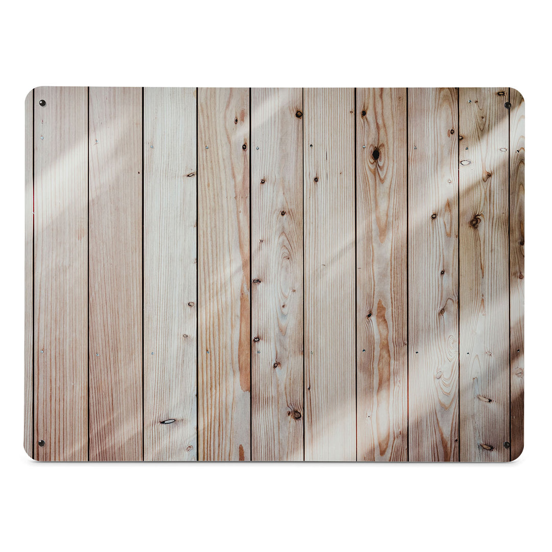 A large magnetic notice board by Beyond the Fridge with a photograph of planks of light coloured wood cladding