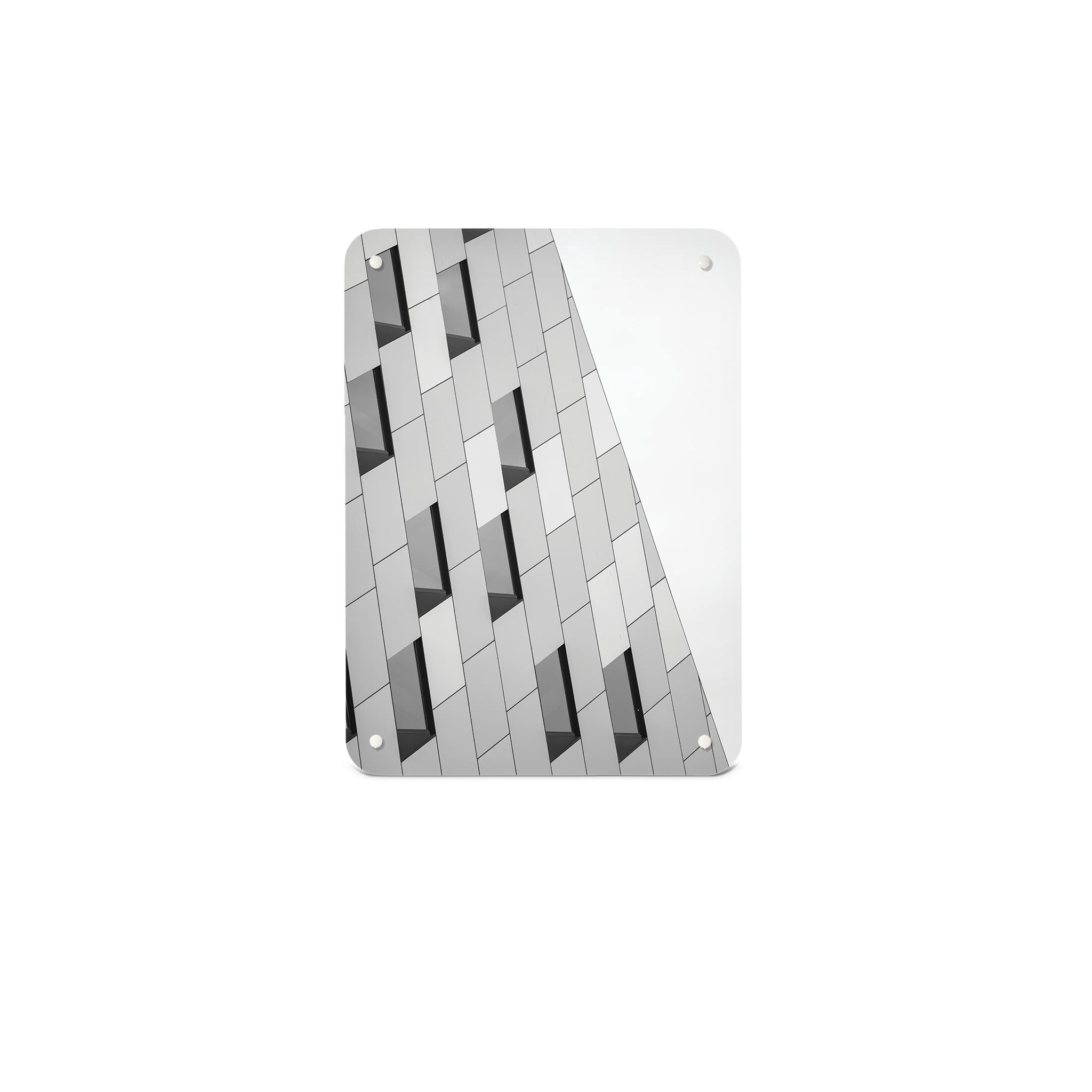 A small magnetic notice board by Beyond the Fridge with an image of an abstract building and windows in black and white