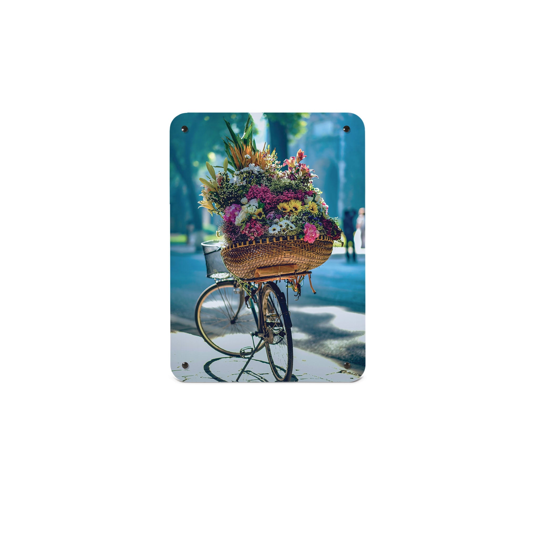 A small magnetic notice board by Beyond the Fridge with a photograph of a bicycle and a large basket of flowers