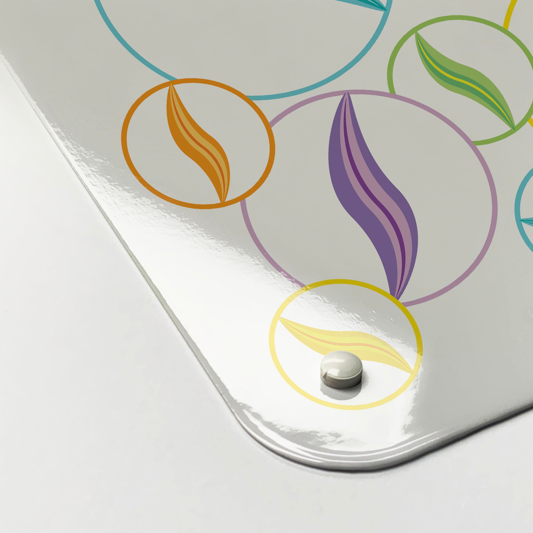 The corner detail of a marbles on white magnetic board to show it’s high gloss surface