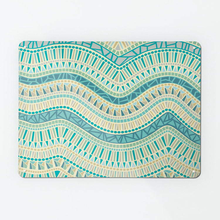 A large magnetic notice board by Beyond the Fridge with an image of a mosaic wave design in ocean colours