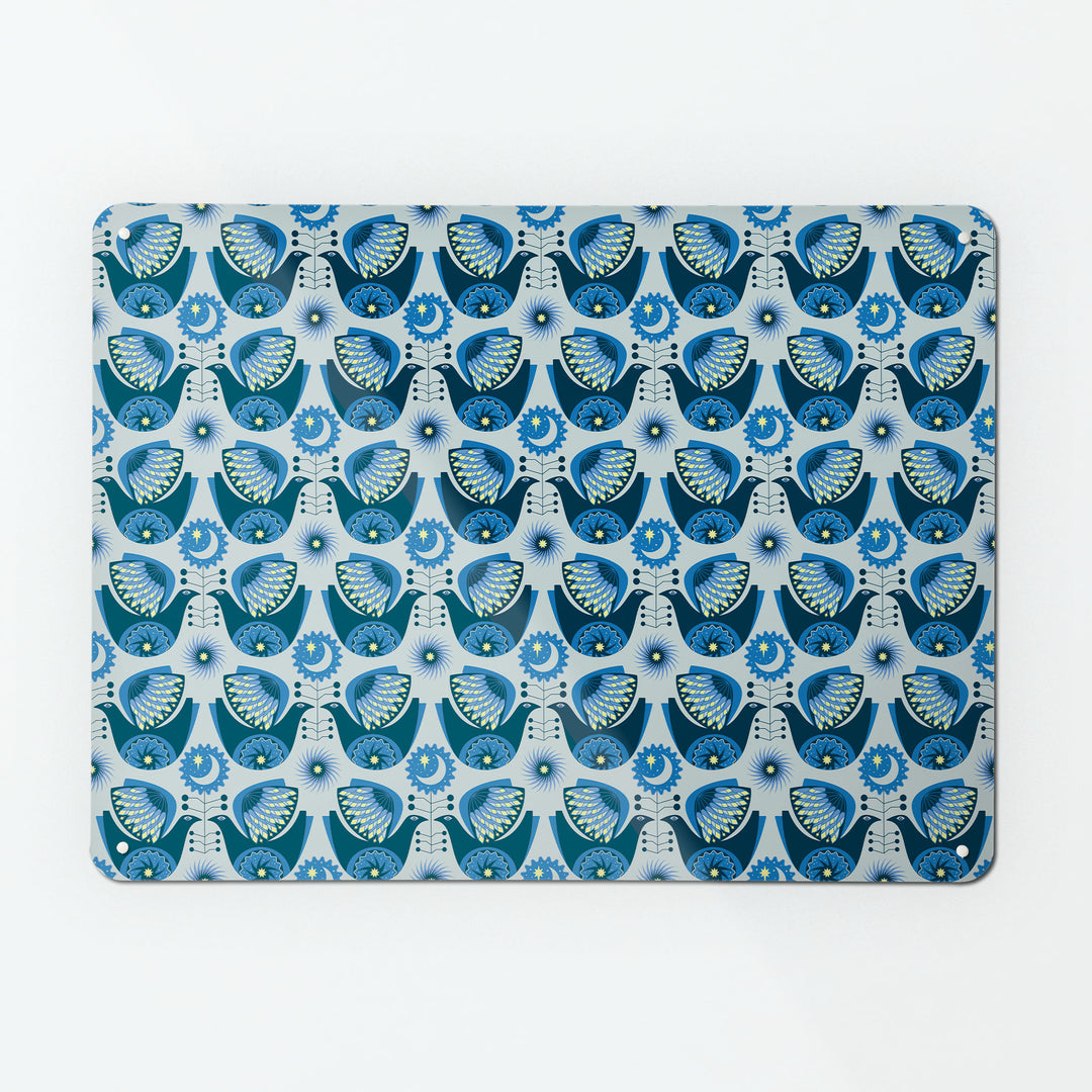 A large magnetic notice board by Beyond the Fridge with a retro style repeat pattern design of night birds in blue colours