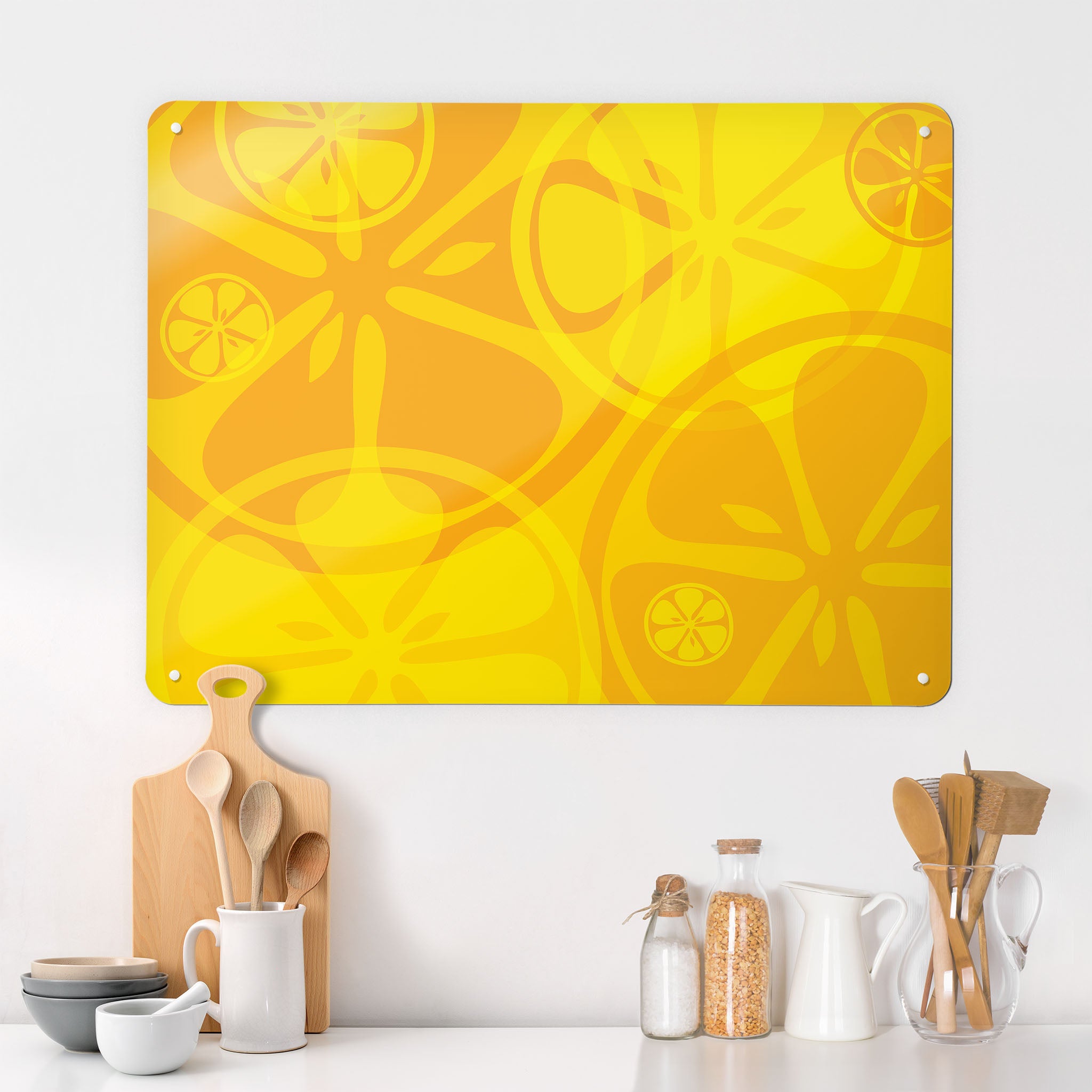 A kitchen interior with a magnetic metal wall art panel showing an oranges and lemons design