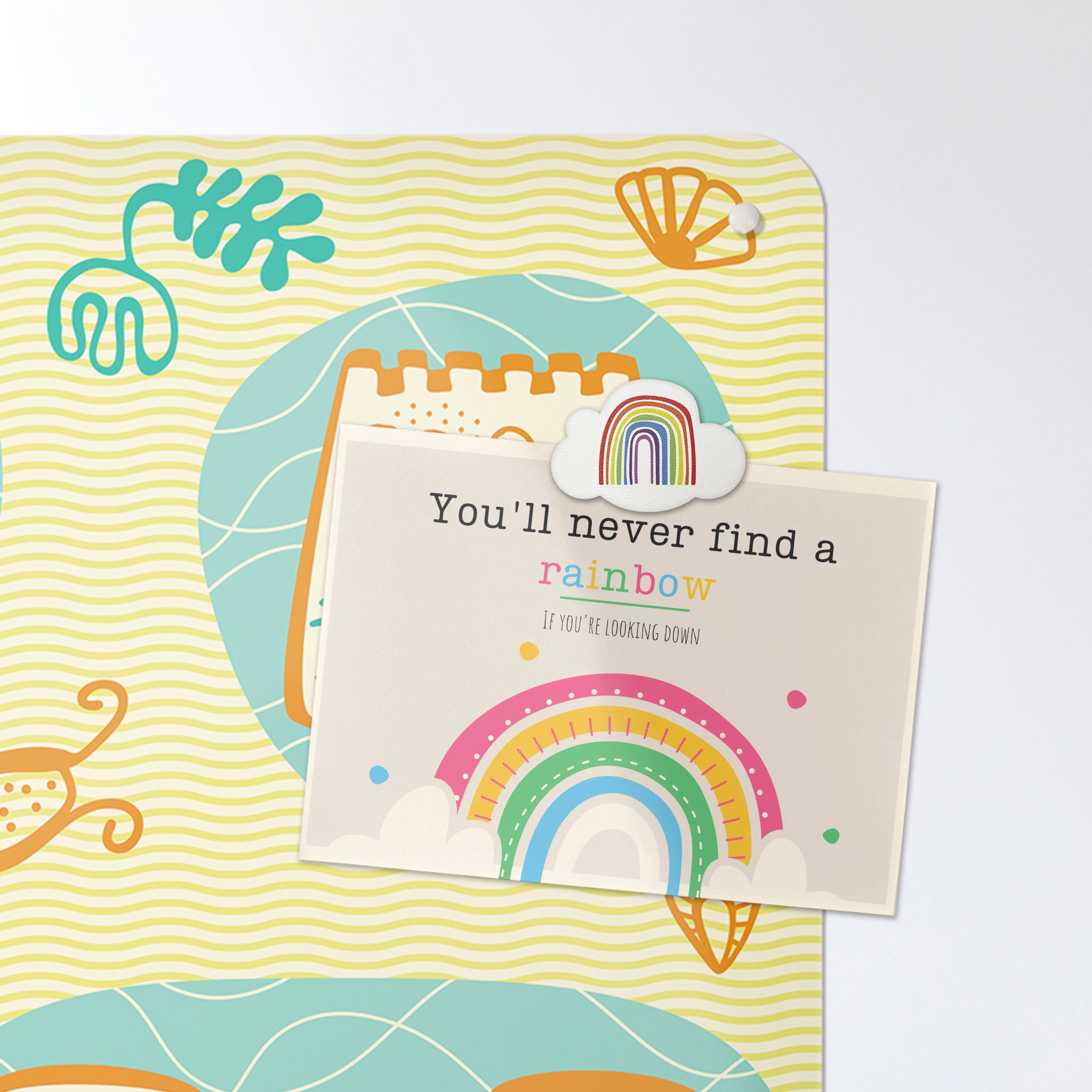 A postcard on a sandcastles design magnetic board or metal wall art panel
