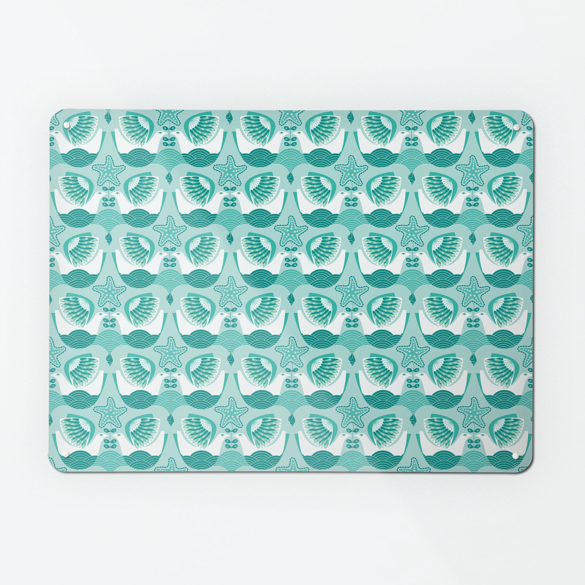 A large magnetic notice board by Beyond the Fridge with a retro style repeat pattern design of seabirds in aqua and white colours