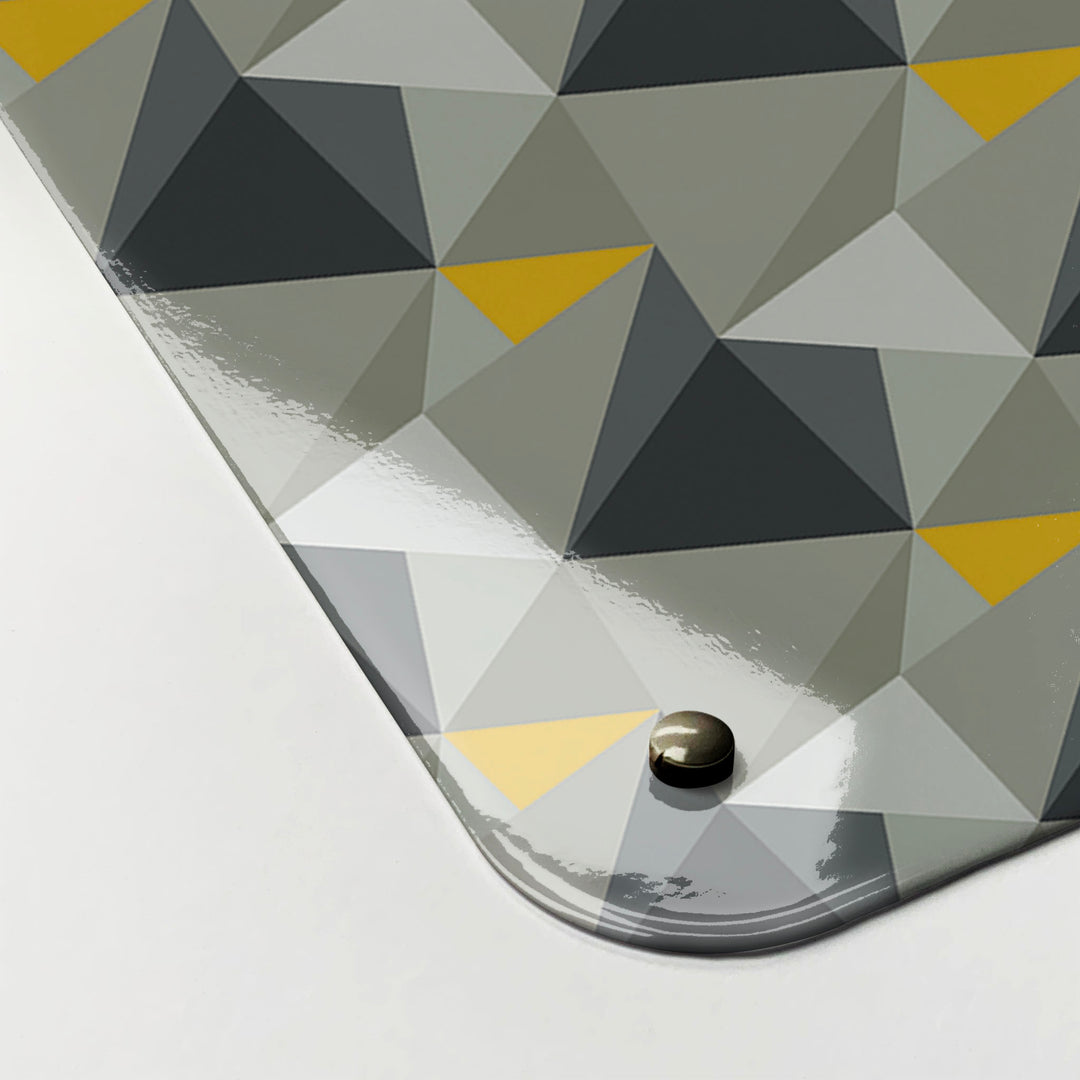 The corner detail of a shards design concrete and yellow magnetic board to show it’s high gloss surface