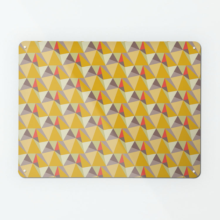 A large magnetic notice board by Beyond the Fridge with a shards geometric design in  yellow, coral and purple colours