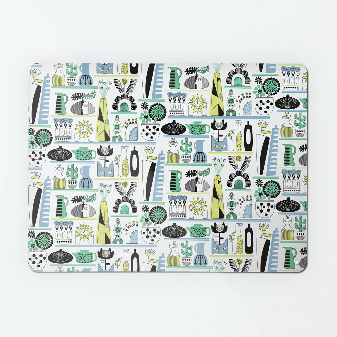 A large magnetic notice board by Beyond the Fridge with a shelf life repeat pattern showing pots, vases and plants in cool colour tones