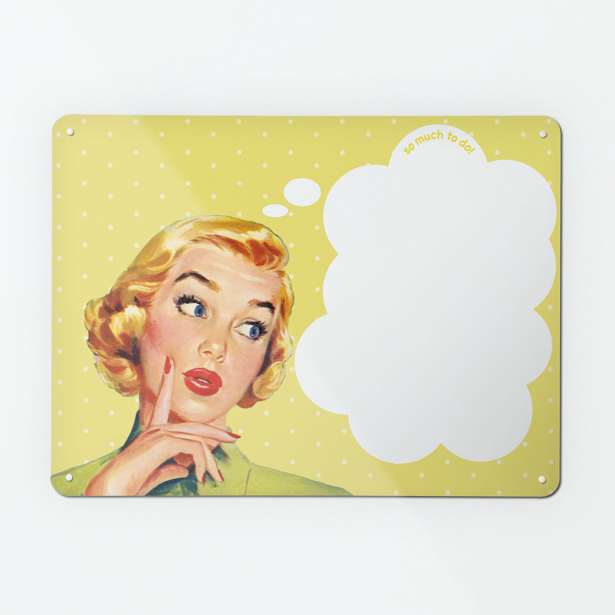 A large dry wipe magnetic notice board by Beyond the Fridge with a vintage girl illustration on yellow polkadot background and white though bubble with 'so much to do' message