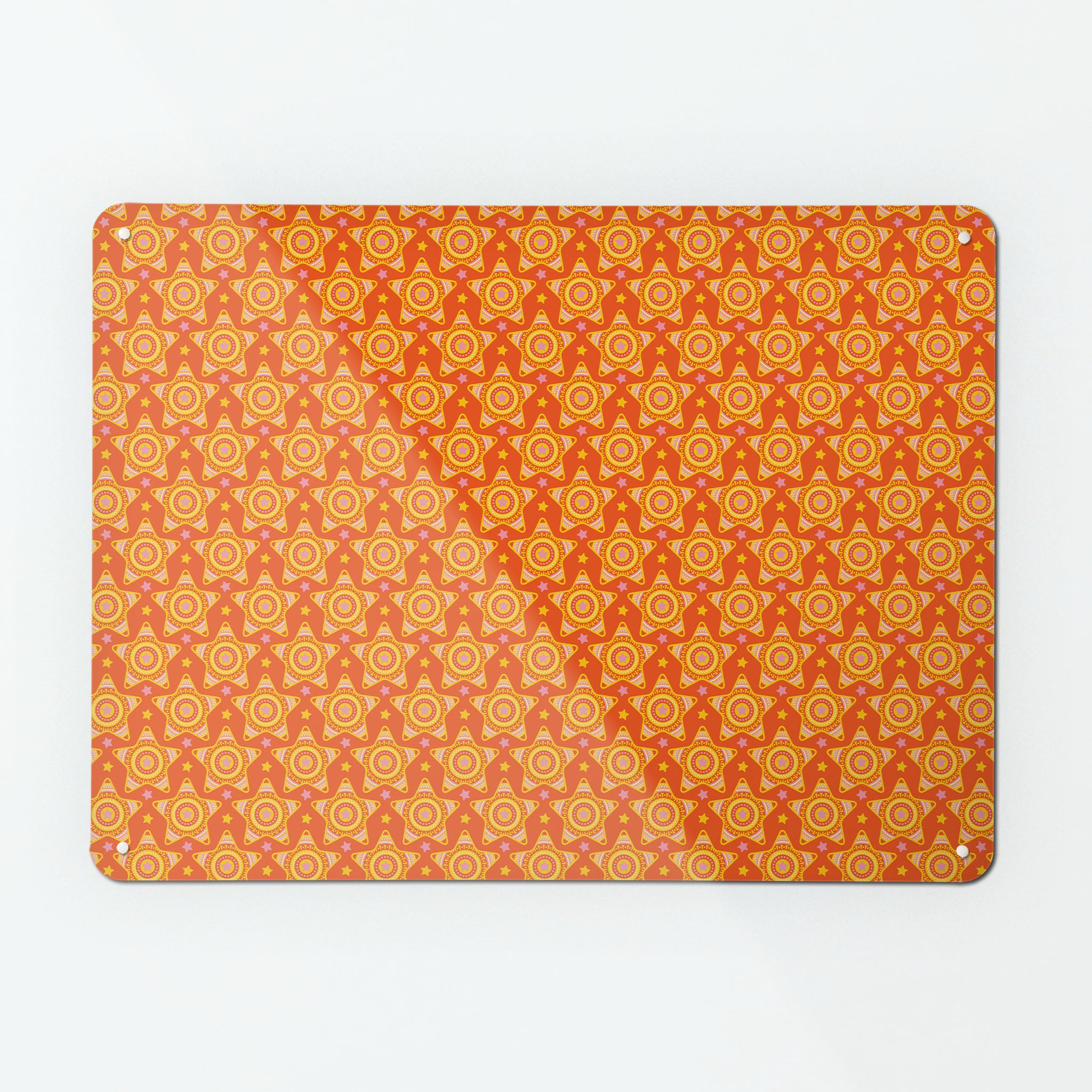 A large magnetic notice board by Beyond the Fridge with a stars on orange pattern
