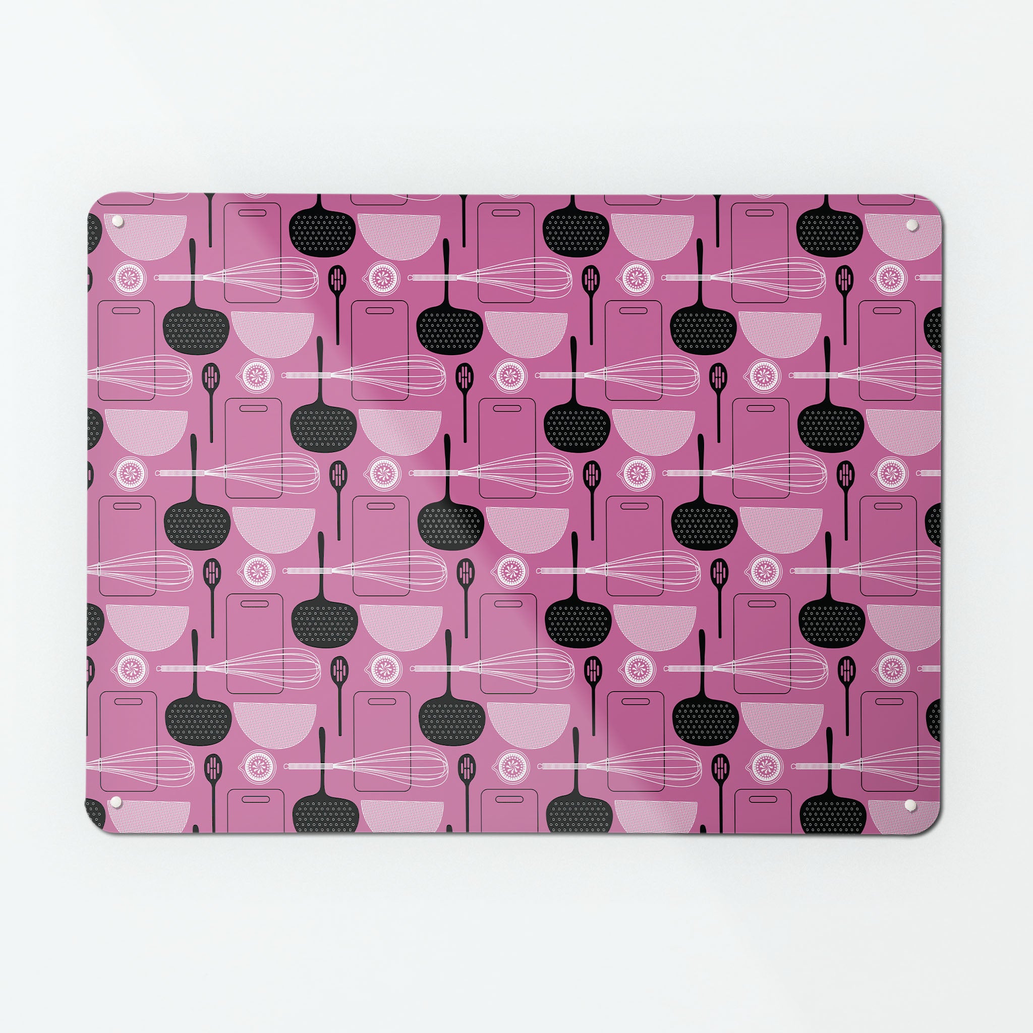 A large magnetic notice board by Beyond the Fridge with a utensils repeat pattern design in pink colour way