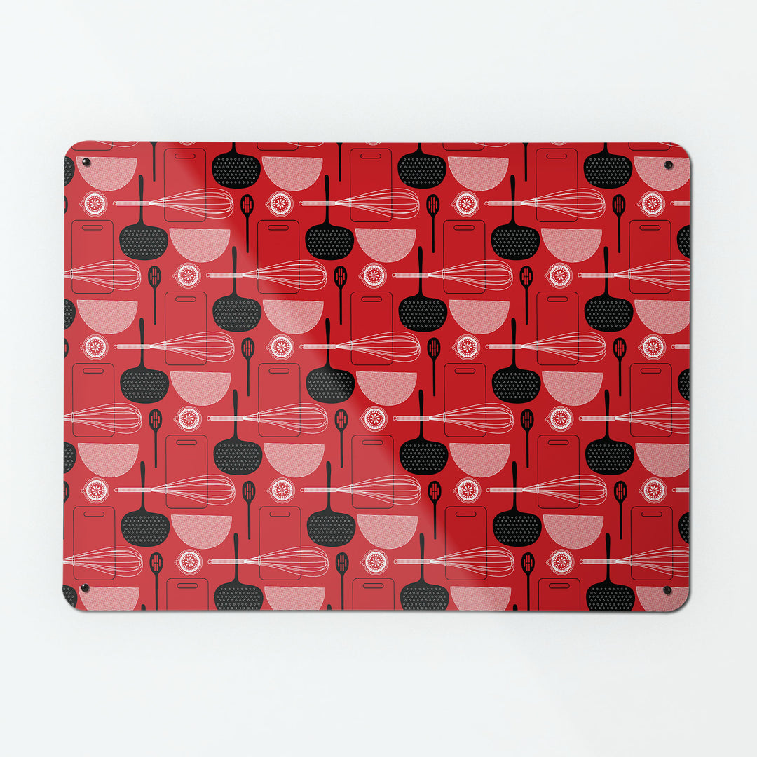 A large magnetic notice board by Beyond the Fridge with a utensils repeat pattern design in red colour way