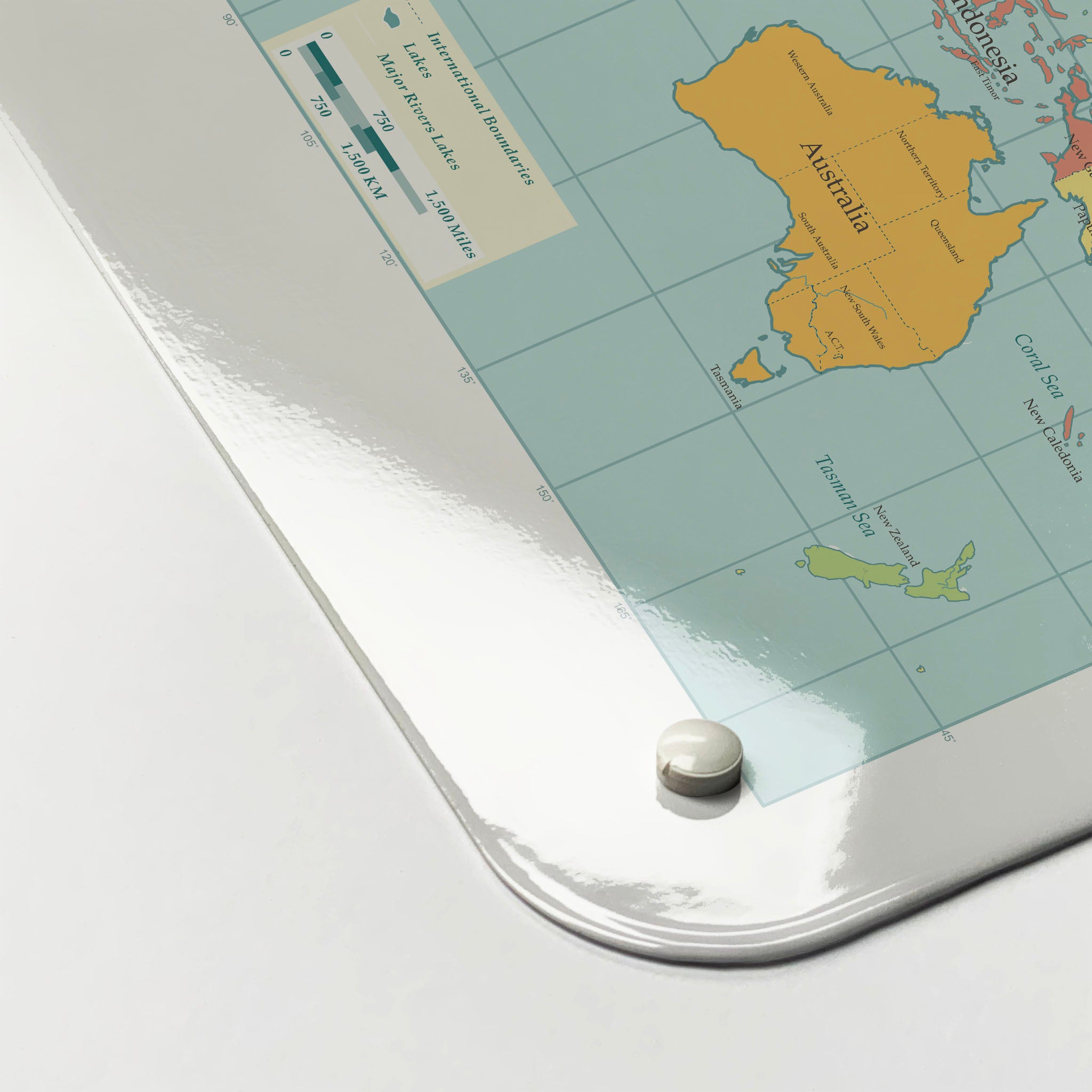 The corner detail of a world map design magnetic board to show it’s high gloss surface