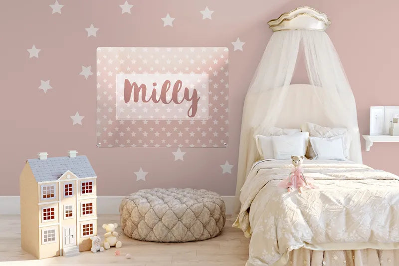 A girl’s bedroom styled in pink with a magnetic board personalised with the name Milly