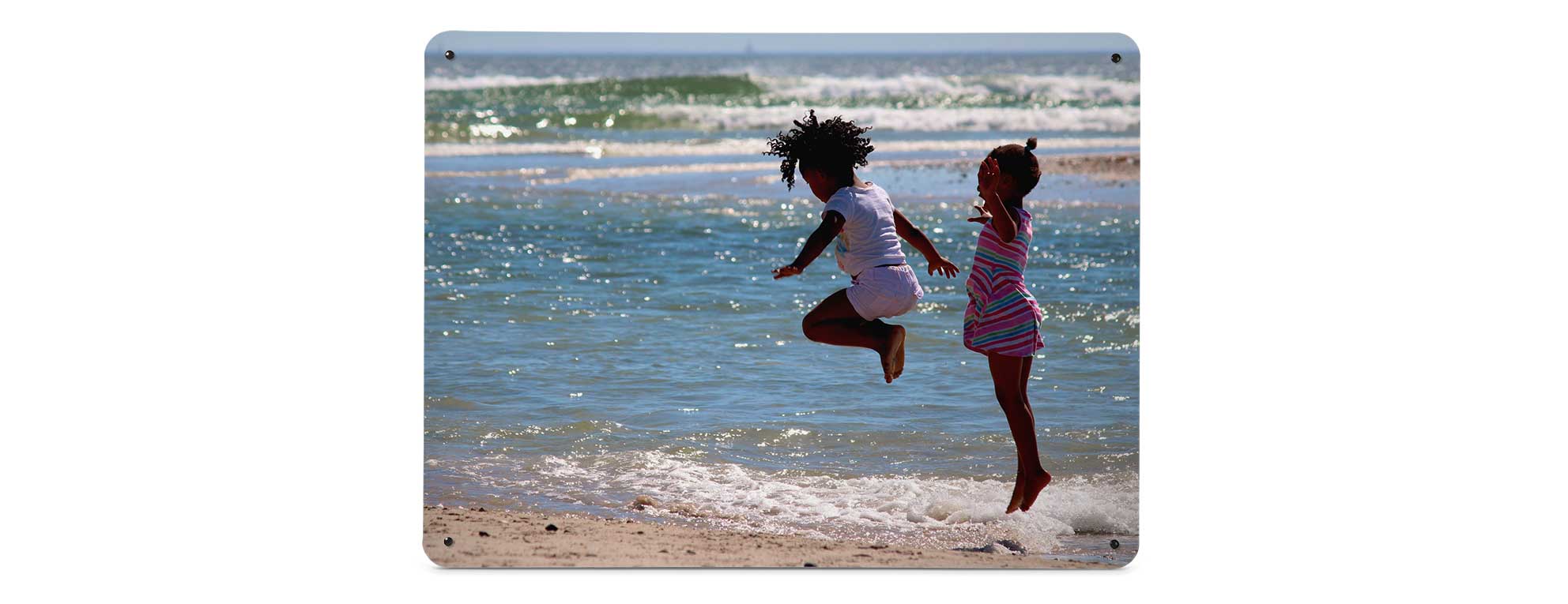example of a Create Your Own magnetic notice board featuring a holiday photo of two girls playing in the sea