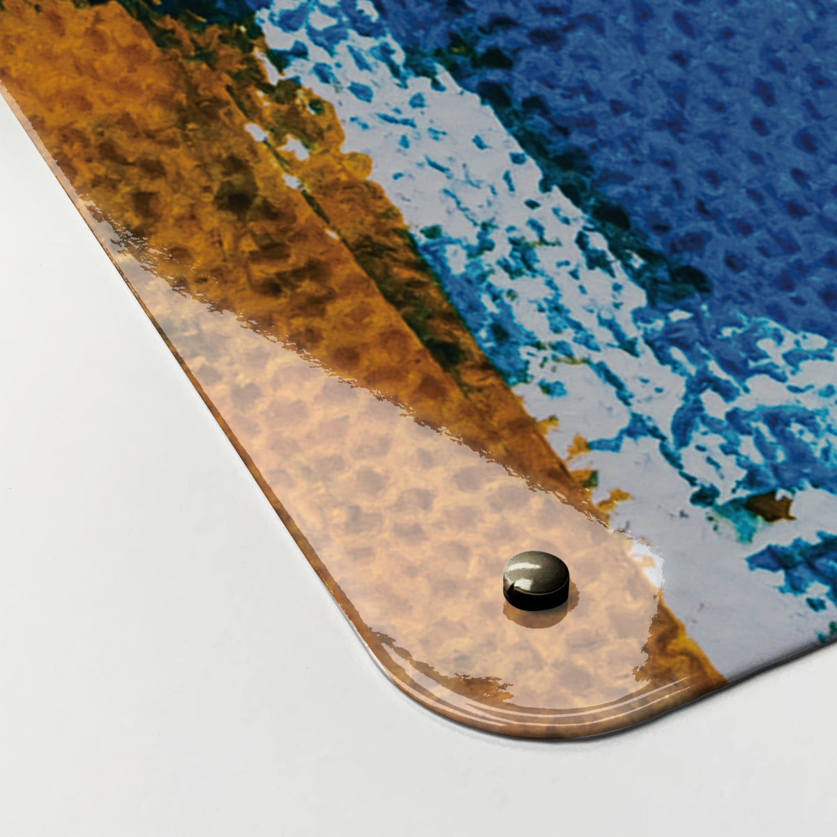 Close-up of the corner of the Abstract Paintings magnetic notice board in October, showing the gloss finish and a screw cap