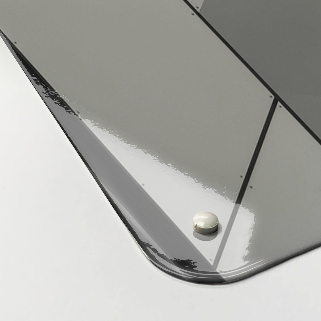 Close-up of the corner of the Abstract Windows magnetic notice board, showing the gloss finish and a screw cap