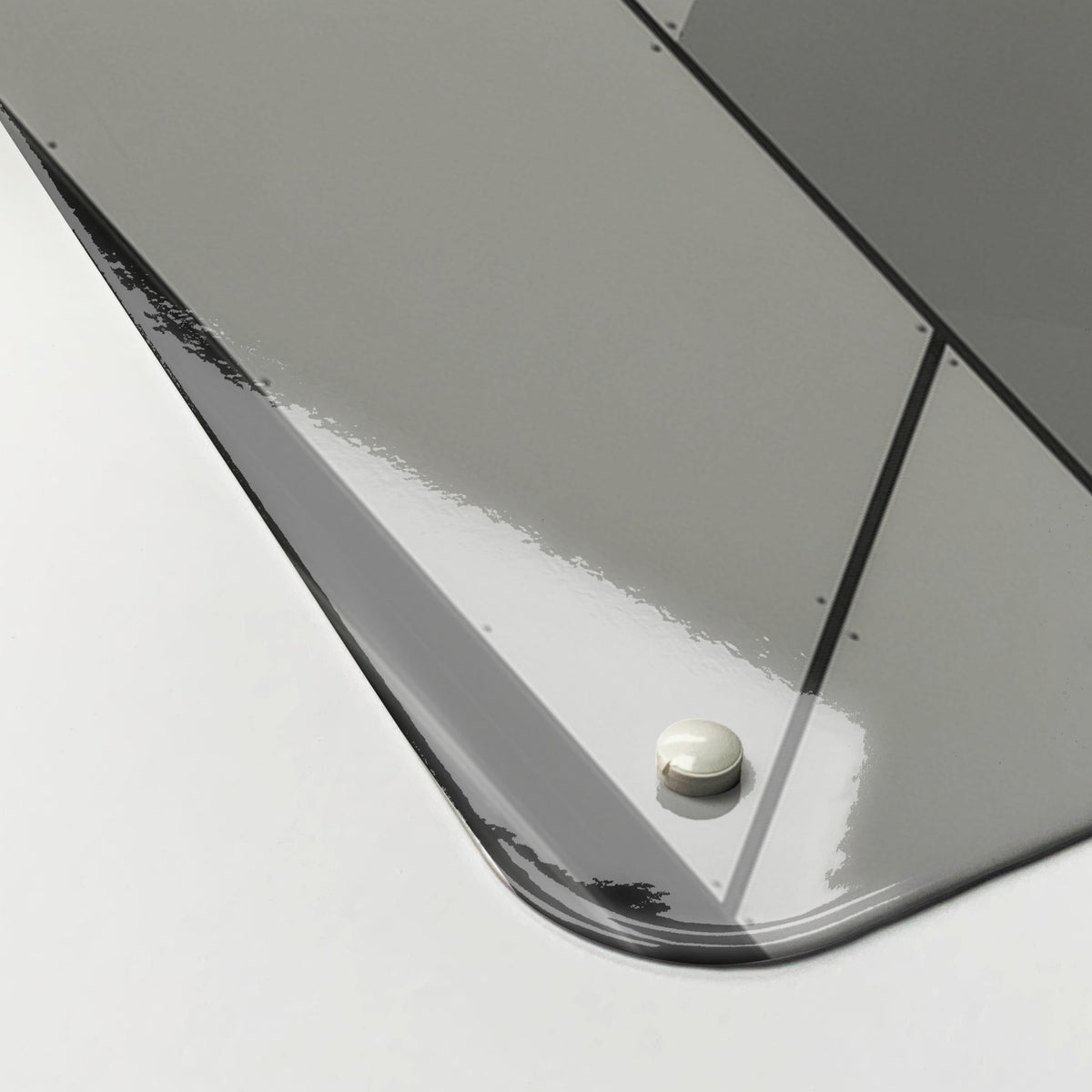 Close-up of the corner of the Abstract Windows magnetic notice board, showing the gloss finish and a screw cap