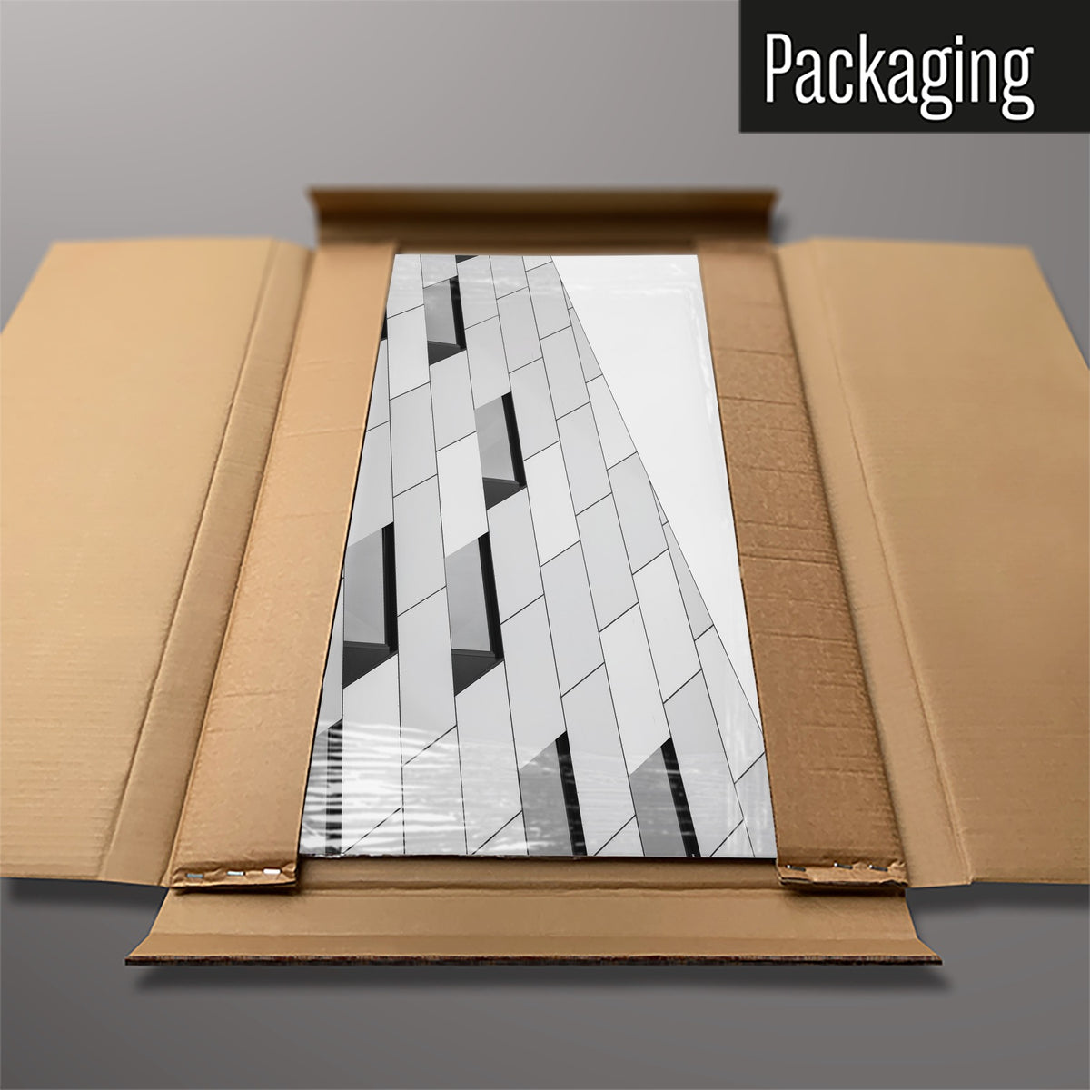 The Abstract Windows magnetic notice board packed flat in its cardboard box