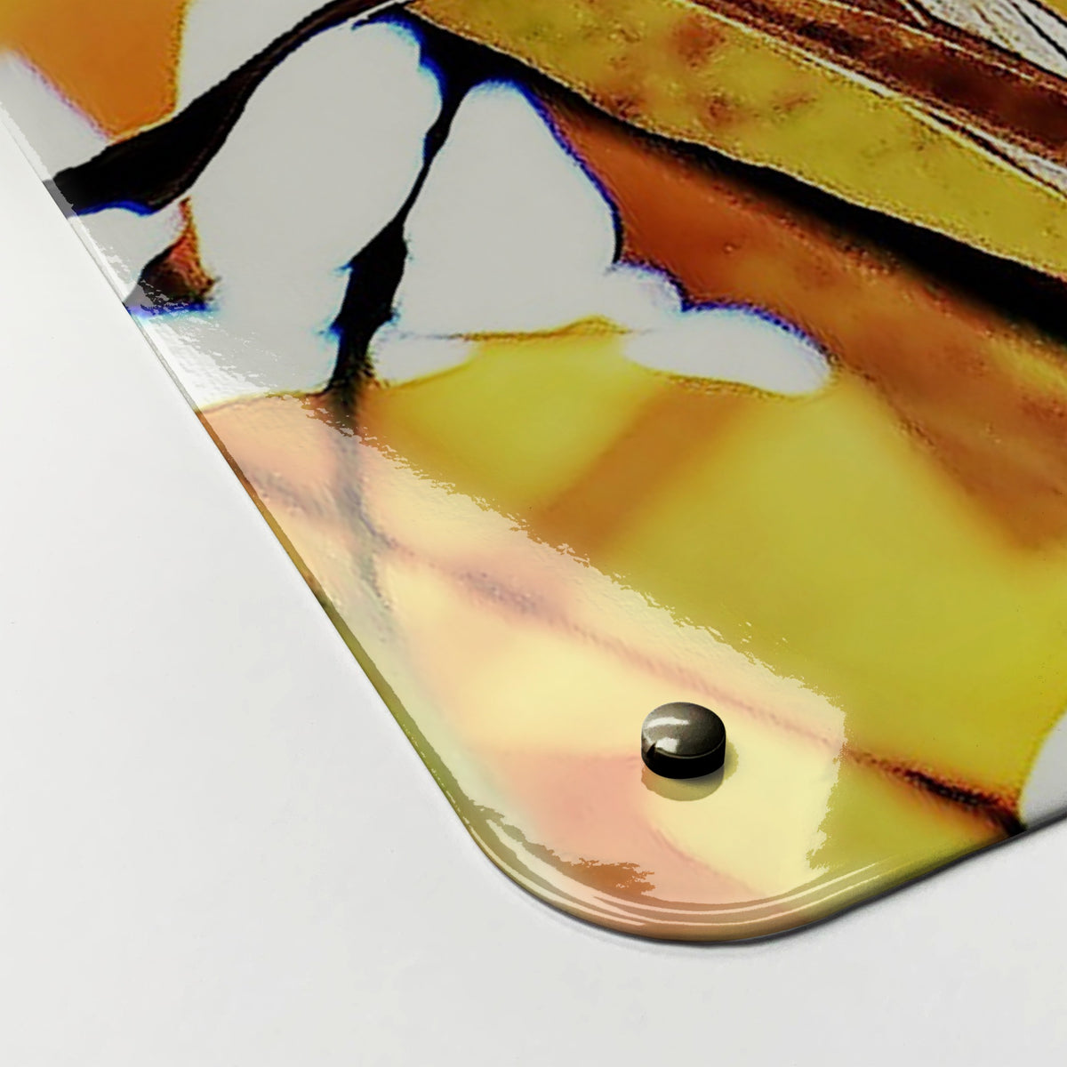 Close-up of the corner of the Autumn Tree magnetic notice board, showing the gloss finish and a screw cap
