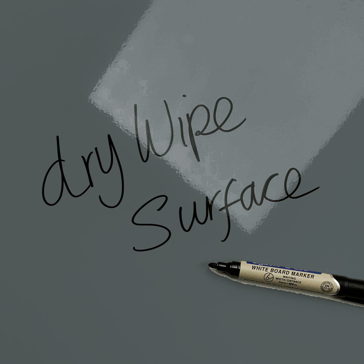 The words dry wipe surface written in marker pen on the Balancing Stones magnetic notice board