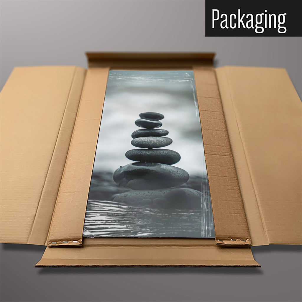 The Balancing Stones magnetic notice board packed flat in its cardboard box